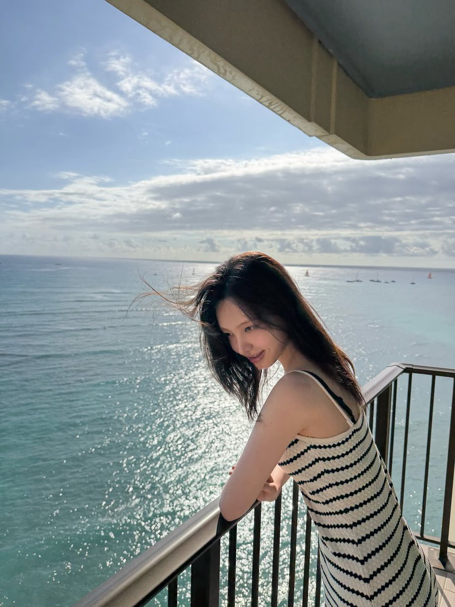 lizeui's tweet image. the sea glittered below as if scattering tiny whispers my way, and i followed each shimmer with the calm curiosity of a girl wandering through her own seaside fable. the sun approved, casting me in a warm glow of its own making 🌤️