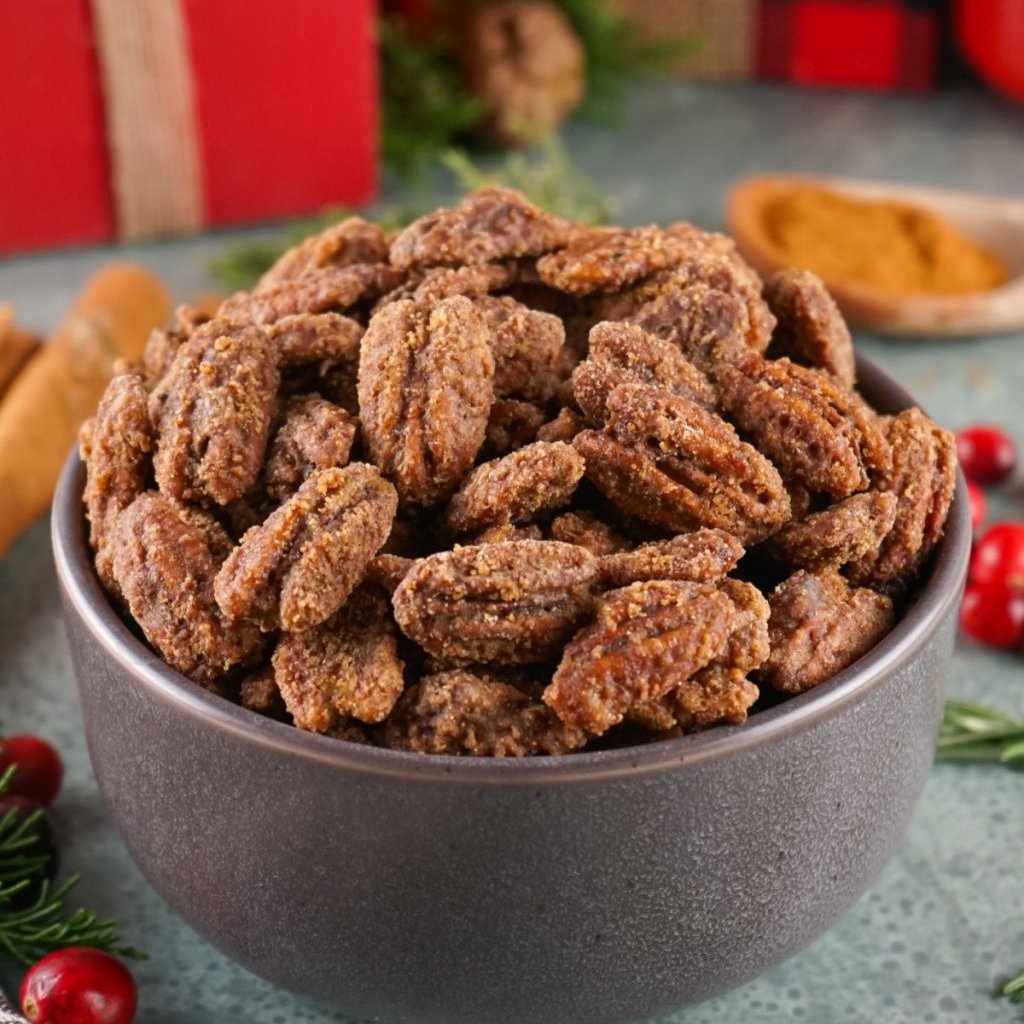 These sweet and spicy Candied Pecans are a must-make holiday treat, perfect for gift-giving, party snacking, and adding a festive touch to your goodie trays. #candiedpecans #pecans #candiednuts #nuts #holidaytreat #Christmas #snack #treat melissassouthernstylekitchen.com/candied-pecans/