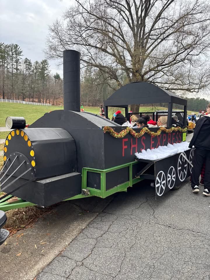 ashuping05's tweet photo. FHS Carpentry classes, led by Scott Brackett and Bryan Cates, built the “FHS Express” for students to ride in the JIRDC Parade! This awesome float won the Community Friends Award at the parade! 
#ignitelearningbcps #CTEforNC https://t.co/gTAQAOf5y3