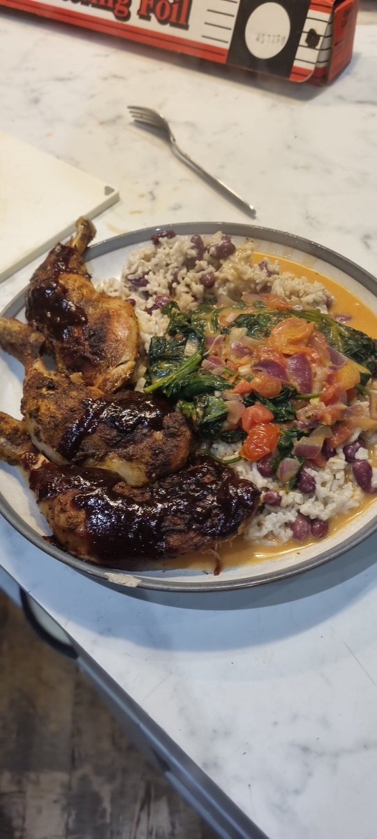 Jerk chicken rice and peas curry spinach.