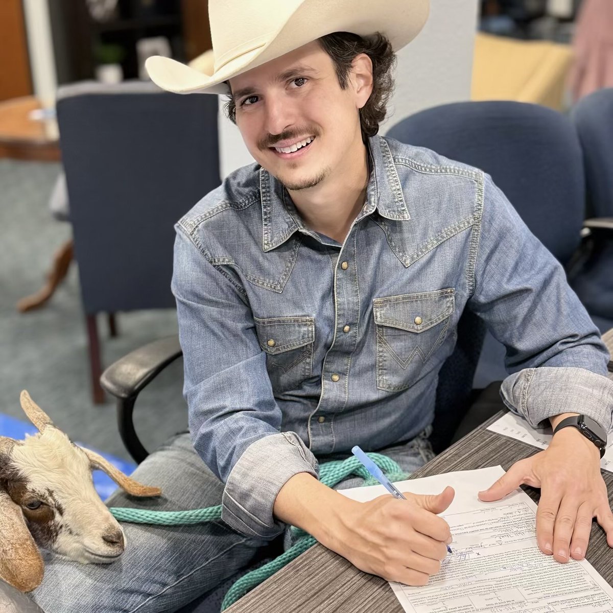 ClaytonTuckerTX's tweet photo. My name is Clayton Tucker, I’m a Democrat running for TX Agriculture Commissioner. I’m running to bust the monopolies rigging our food system so we can make food/farming affordable. Brought my goat LBJ along with me to officially file (he thinks he’s a city goat now!). Join our campaign to fight the food oligarchs — they may have organized money, but we have organized goats! 🐐👊