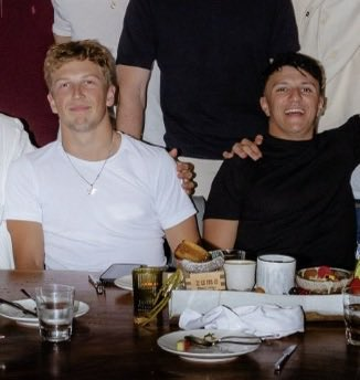 yapperlawson's tweet photo. They look like they're holding hands under the table 😌💙 https://t.co/fzhMAQog68