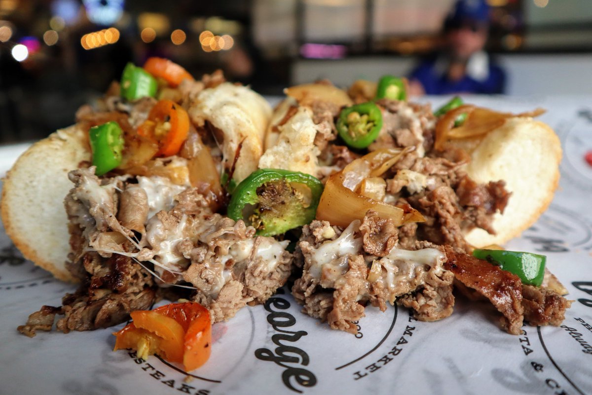 This incredible cheesesteak could be yours! Come on down to by George and order a cheesesteak with your choice of cheese, onions if you'd like, and don't forget the hot peppers! 🌶️