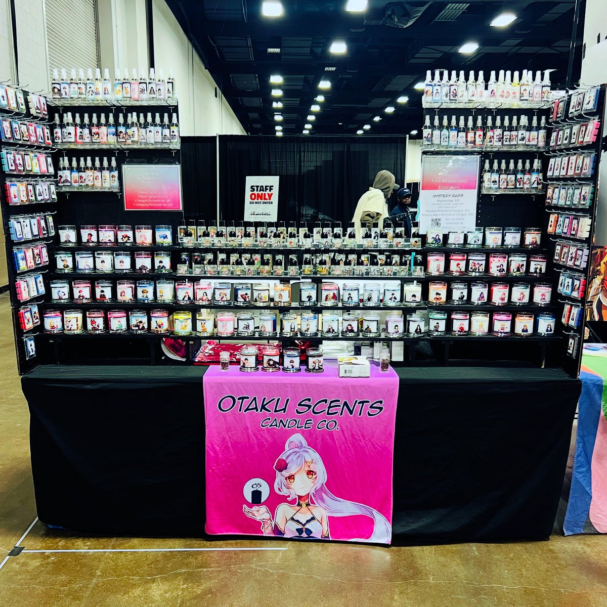 All set up at @animefrontiertx at Artist Alley table R14! Come by, say hi, and smell some goodies 🥰