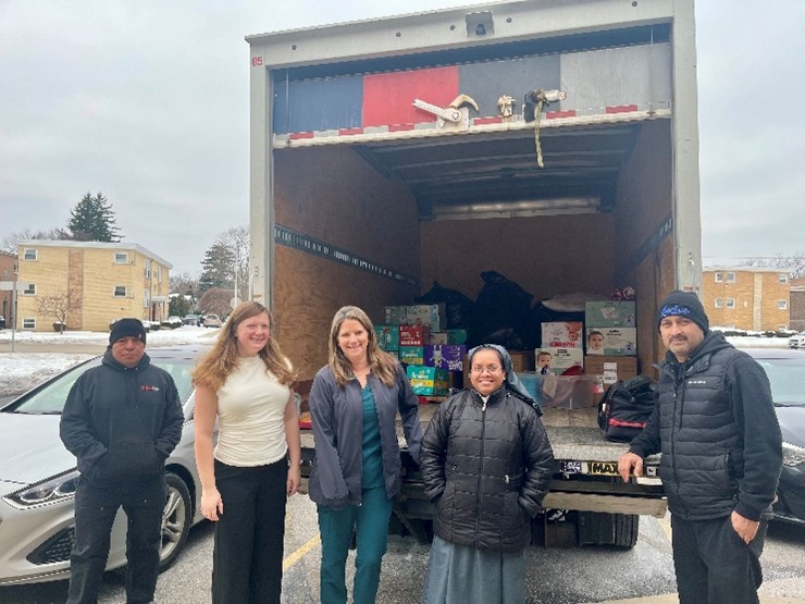 Getting Ready for the Big Day
Tomorrow is the Annual Aid for Women Client Christmas Party! We are always grateful for wonderful community partners like PureClean who help us prepare for this special occasion. This truck of Santa’s elves from PureClean helped transport gifts for