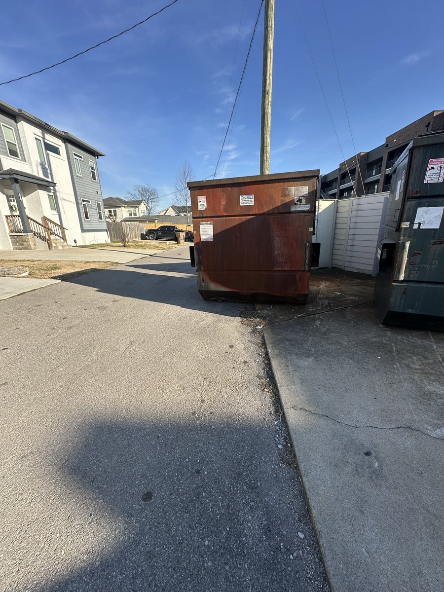 RowdyRahal's tweet photo. @MetroNashville @hubNashville @SeanForFive If the driver’s can’t put the dumpster where it belongs behind 1069 East Trinity Lane, we’ll need to have condo units move it elsewhere. Move it, or the alley will be blocked immediately. Tired of people using my driveway to avoid it. https://t.co/XgxCKjd0z7
