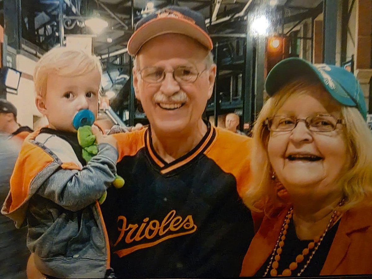 IrishHoya's tweet photo. @Orioles Not a jersey per se, but I love this picture of my parents with my nephew (their only grandchild) as this was  summer 2018 before my Mom got sick in 2019. She hasn't been to a game since. https://t.co/kKwtFSiRSd
