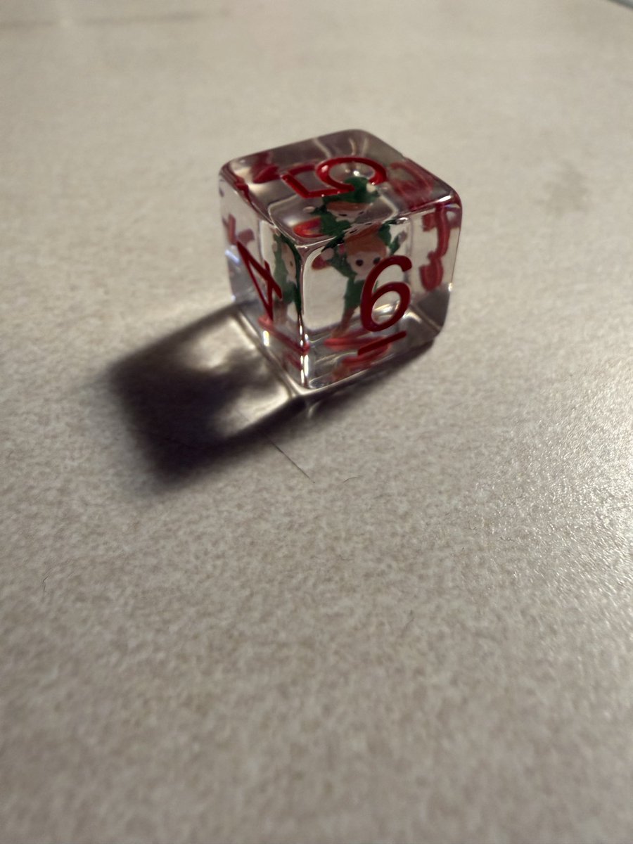 Dice #AdventCalendar for December 5, 2025! Today it’s another elf inclusion die - a D6!
<a href="/FanRollDice/">FanRoll by Metallic Dice Games</a> #DnD #ttrpg #ttrpgcommunity #Christmas2025 #Dice #DnD #dnd5e