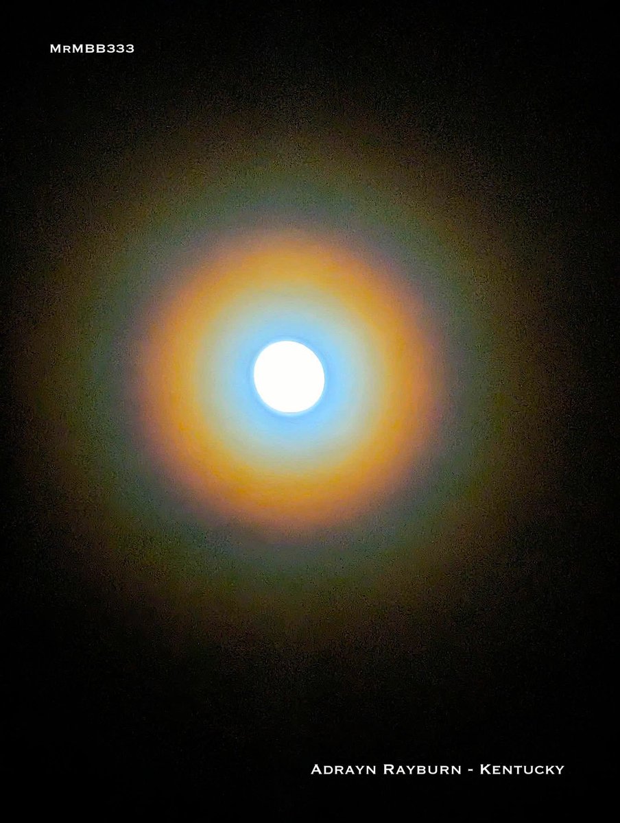 THE MOON JUST FORMED A PERFECT, MULTI-COLOR HALO — AND THE VIEWER SAW IT  WITH THEIR OWN EYES. Not a camera trick. Not a lens flare. A full rainbow  ring around the, image size:904x1200