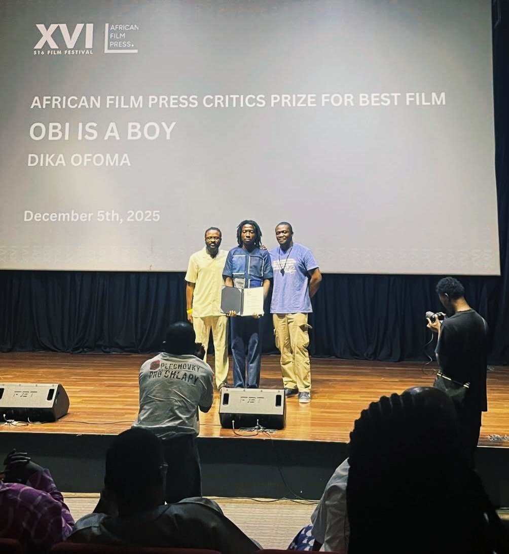 akorokoafrica's tweet photo. The first African Film Press (AFP) Critics Prize — presented at the 5th edition of the S16 Film Festival in Lagos on December 5, 2025 — goes to Nigerian filmmaker Dika Ofoma for his short film "Obi Is a Boy."

“For its observational realism, its controlled performances, and its clear attention to everyday detail in a young man’s decision to live on his own terms under family pressure and social stigma.” ~ Jury statement

We thank Surreal 16 — C.J. Obasi, Abba Makama, and Michael Omonua — founders of the S16 Film Festival in Lagos, for building a space that centers critical attention on African cinema and the work of its filmmakers.

The AFP Critics Prize is now officially launched.

The next AFP Critics Prize will be presented at another African film festival on the continent. The specific festival will be announced soon.

Pictured, L-R: Ikeade Oriade (AFP partner What Kept Me Up), Dika Ofoma, C.J. Obasi (S16).

African Film Press (AFP) is a recently launched alliance between @Akoroko (Pan-African & Diaspora), @sinemafocuske (Kenya & broader East Africa), and @WKM_Up (Nigeria).

#AFPCriticsPrize
#S16FilmFestival
#AfricanCinema
#AfricanFilmPress