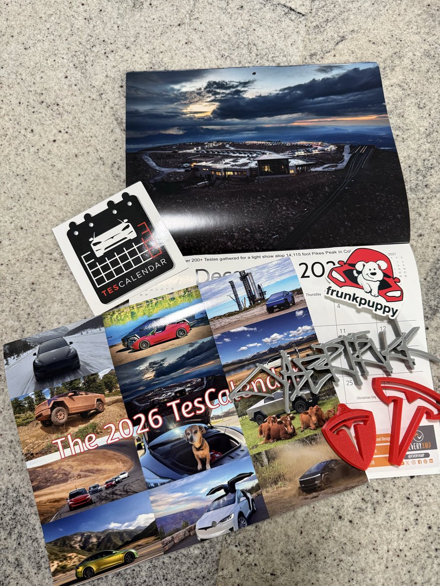 BitzLolo's tweet photo. When you order a calendar and get a whole little Tesla care package instead 😍 2026 TesCalendar has officially landed! Thanks for the awesome extras, @TesCalendar1 @DenverTeslaClub 
#TeslaCommunity #TesCalendar #EVLove #FrunkPuppy https://t.co/AgxpbwmFwf