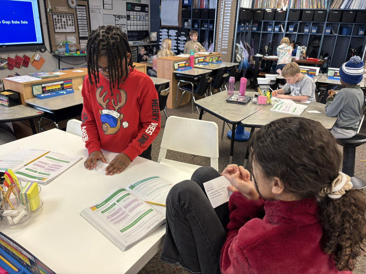 PVWollberg's tweet image. There are some chairs in rows and some stacked in a corner. How many chairs are there altogether? 

Working with partners to figure out what information is needed in order to answer the question.  #pvlearns #mathisfun @IllustrateMath