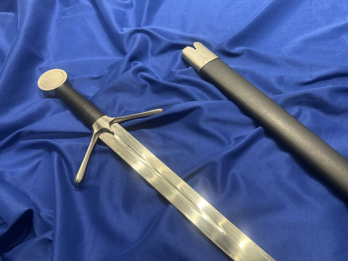 Our Scottish Single-hand Sword is patterned after 15th century models originating in the west highlands and the western isles. The peened wheel pommel, lobed quillons and short langet are typical of surviving pieces. The hilt has a leather wrapped grip with a wood core