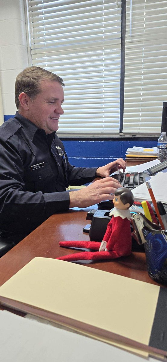 The Elf cruising the streets , and helping Officer Purcell with lots and lots of paperwork.