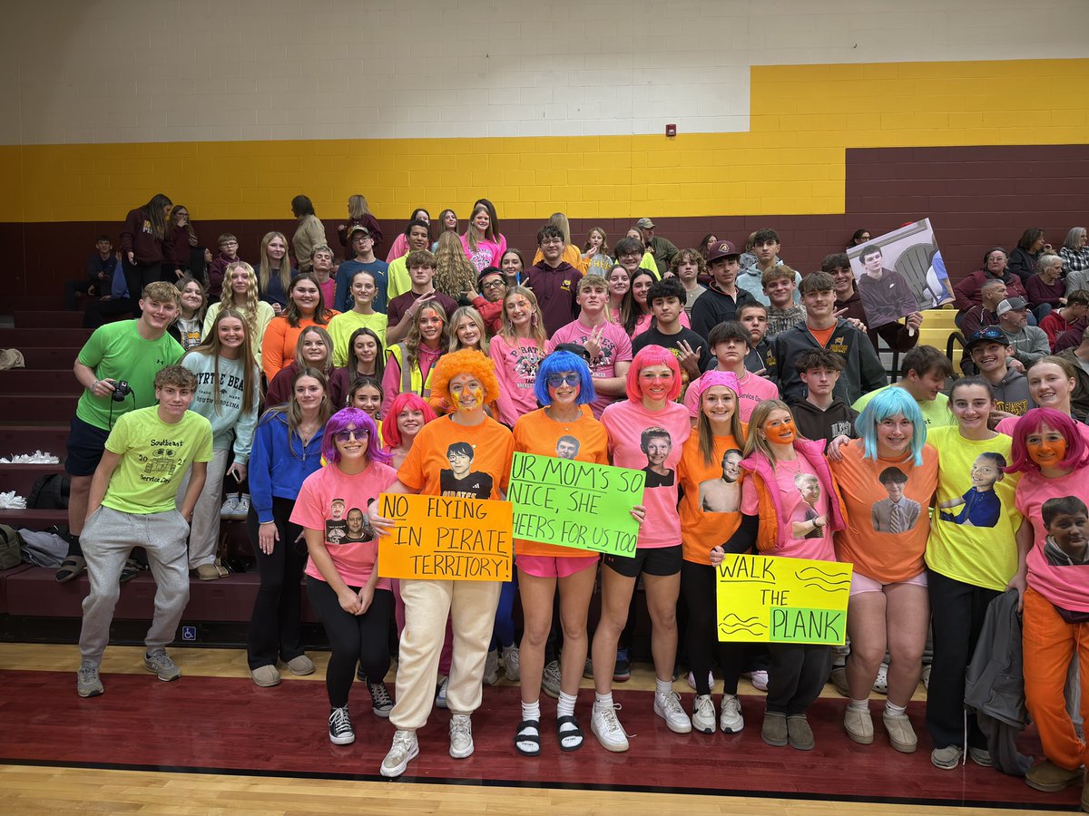 Student section lighting up the stands on neon night!