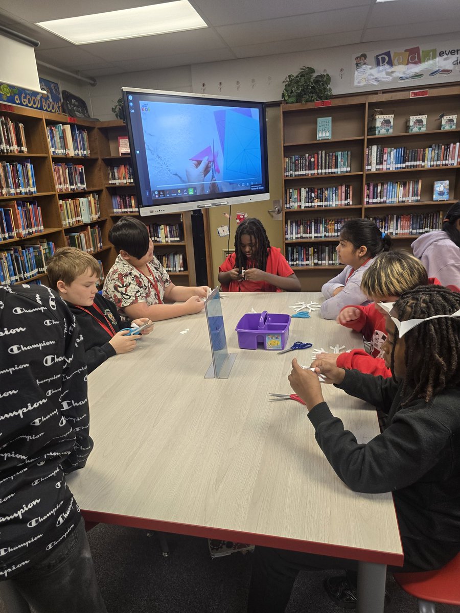 Snow outside and 6th graders are making snowflakes inside the library!  All part of our Team-Building Winter Wonderland.  #WeAreJCPS #meyzeekreads #JCPSlibraries