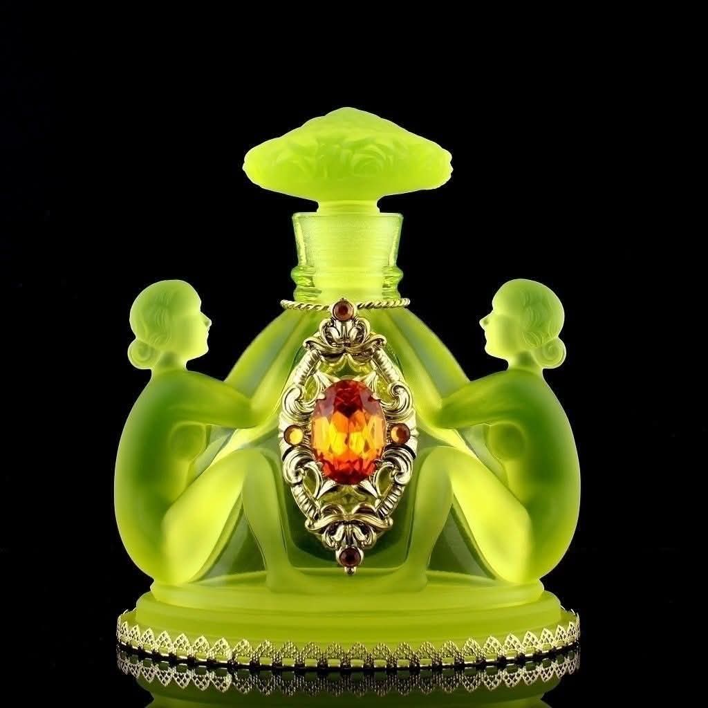 An Art Deco Bohemian Vaseline Glass Perfume Bottle. These bottles were crafted in Czechoslovakia, often by Heinrich Hoffmann, during the 1920s and 1930s.