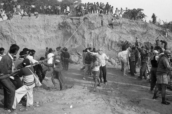 thehawkeyex's tweet photo. The Pioneer photojournalist, Praveen Jain captured this iconic photograph on 5 December 1996, a day before the Babri demolition.

In those days, Praveen Jain was covering the Ram Janmbhoomi Andolan. He recalled this Ayodhya moment in an interview later that how he approached his old-time friend, a VHP leader, to get the exclusive content. The VHP leader asked him to visit a particular place next morning which is 5th December. He got the exclusive access to this site by means of a VHP-member visiting card arranged by his friend.

He was stunned by what he witnessed. He knew he was going to capture the historic moment. Here, the Hindu organisation's workers and karsevaks were rehearsing the demolition.

By this time he knew what was going to happen on 6th December. He shared this exclusive moment with other photojournalists, who didn't believe him.

In the next 24 hours, on 6th December, the disputed structure was demolished. There is hardly any photo evidence of the main structure being pulled down. It is only captured in the memories of a few karsevaks. The rest is history.