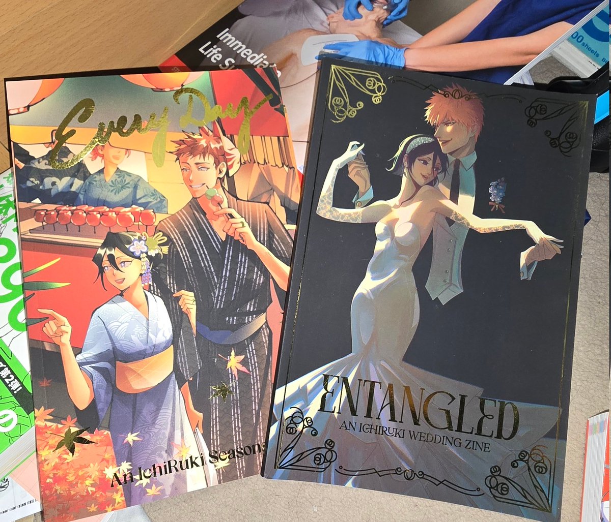 art_jaypg's tweet photo. I'm packing my things up because I'm moving to a new house—and look what I found! I'm always going to be grateful for the experience of being a mod for a zine dedicated to my most beloved ship since childhood, #IchiRuki. Vol. 1 &amp; 2 with @ichirukizine 🧡💜 (Vol. 3?? 🤔) https://t.co/F531dLdRR3