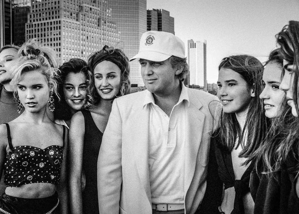 Donald Trump posing with teen models at the “Look of the Year” competition, 1991