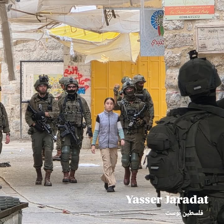 Images show Israeli settlers storming the Old City of Hebron under army protection.