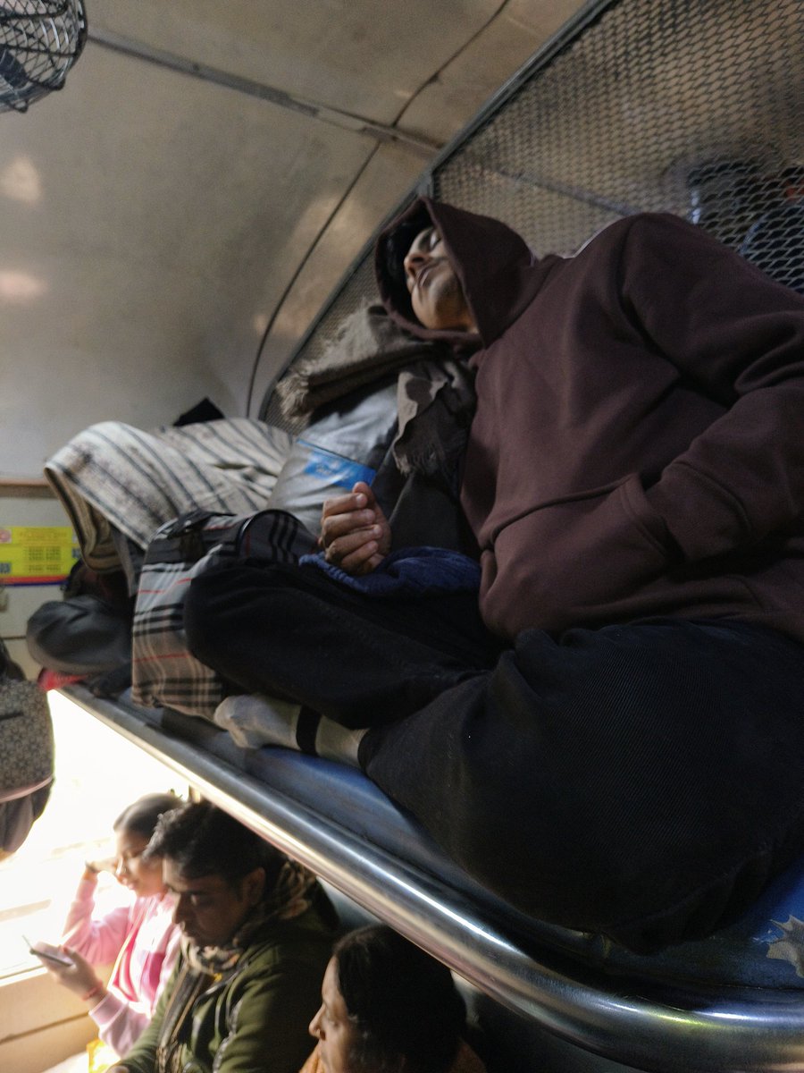 ppdcool's tweet image. Is it allowed to sit like this occupying seat in General compartment of a train when hundreds of other passengers are standing?@RailwaySeva @RailMinIndia @RailMadad @RPFCR