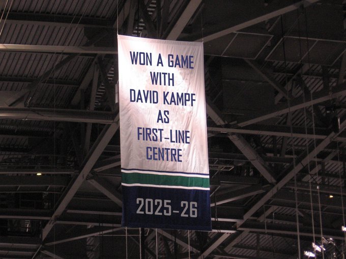 Meme of Canucks banner at Rogers Arena: "Won a game with David Kämpf as first-line centre, 2025-26"