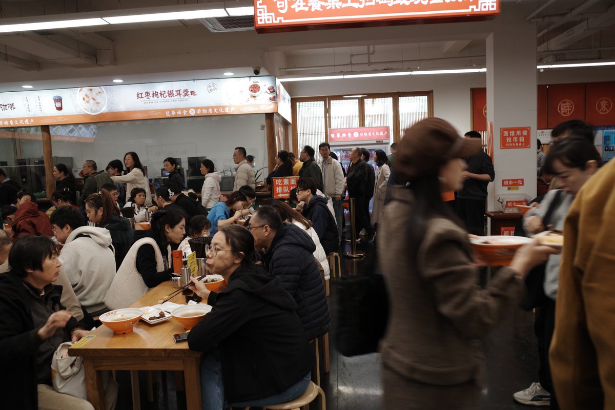 shanlinsengren's tweet photo. You can get a wonderful, mushroom filled bowl of noodles at #Longhua #temple, along with pickled veg and some kind of tofu. The line was a few hundred metres long. You scan &amp; self-pay at the table. 15 rmb for the noodles, 10 rmb for the pickled veg and tofu. #Shanghai https://t.co/aZ1Sw1QYIq