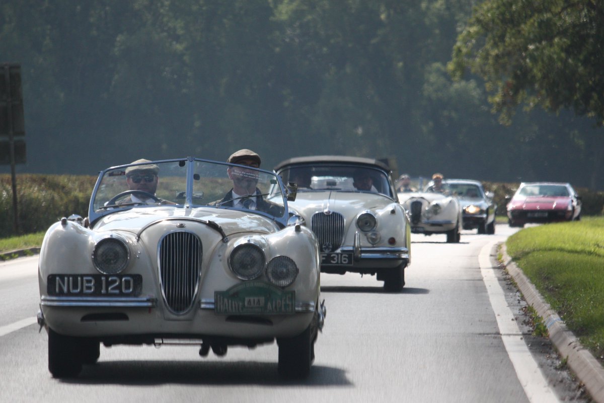 Two Jaguars leading the pack through the English countryside - dashing hats, sharp suits, and that unmistakable timeless charm. Last year’s drive at Gaydon was nothing short of classic cool. 

📸 @jaguardaimlerheritage.trust  
🌎 UK, Gaydon