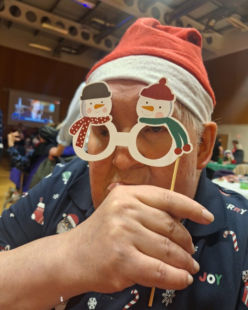 Festive spirit was in full swing for our resident Bruce at the day centre Christmas party! 🎄 Dressed in his Christmas best, he was all smiles as he met Santa 🎅