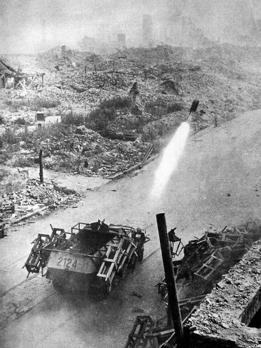 TheWorldatWar2's tweet photo. A German Sd.Kfz 251 fitted with the Wurfrahmen 40 ("launch frame 40") in action - date and location unknown #1940s #history #ww2 #ww2history #halftrack https://t.co/o1ScO39tuX