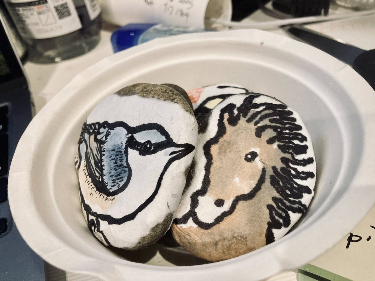 Yesterday  a friend and I entertained ourselves by painting  simple images on washi cards, tearing the images out of the cards by  hand, gluing the images onto the stones, and finally, writing some words  on the back of the stones. Ta da! Etegami stones!