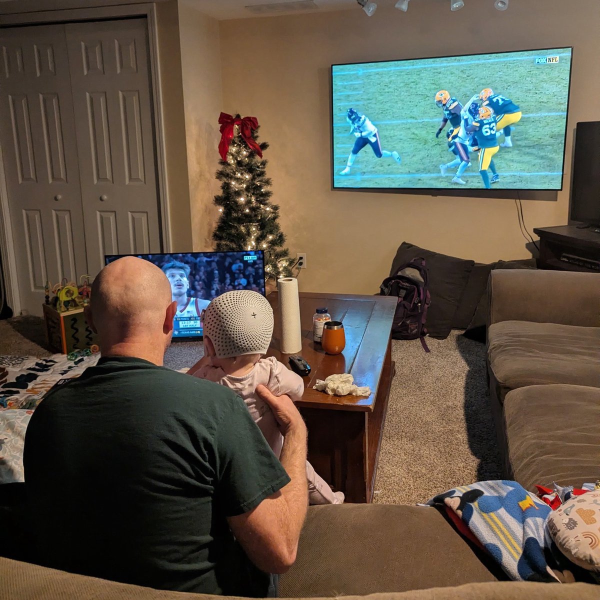 Peak dad moment for me. Nebraska basketball on one tv, packers on the other, juggling a cranky/sick daughter who just wants to be with dad.
