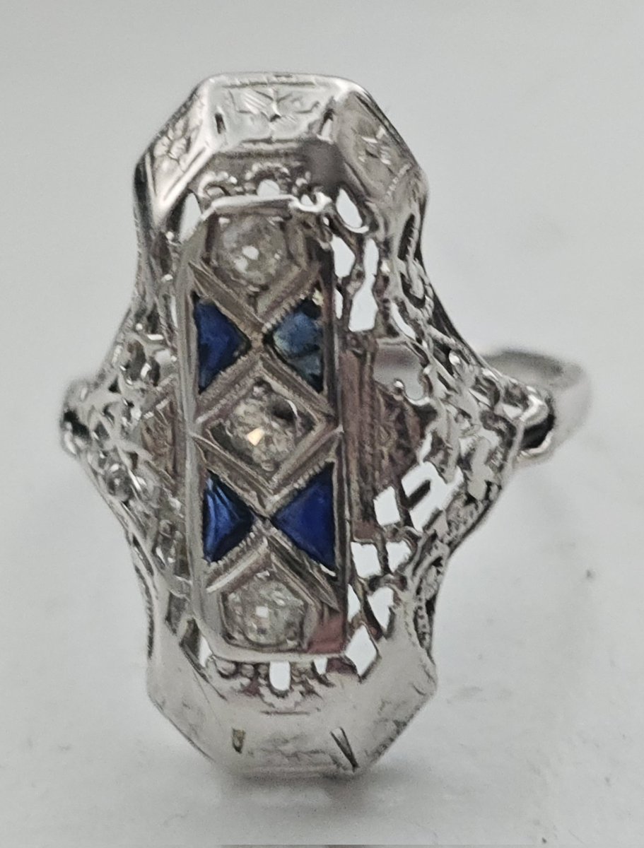 Vintage 1919 thru 1939
Experience the ultimate in timeless elegance with this Vintage Art Deco White Gold Diamond Sapphire Filigree Ring exclusively available at Distinctive Vintage. 
distinctivevintage.com