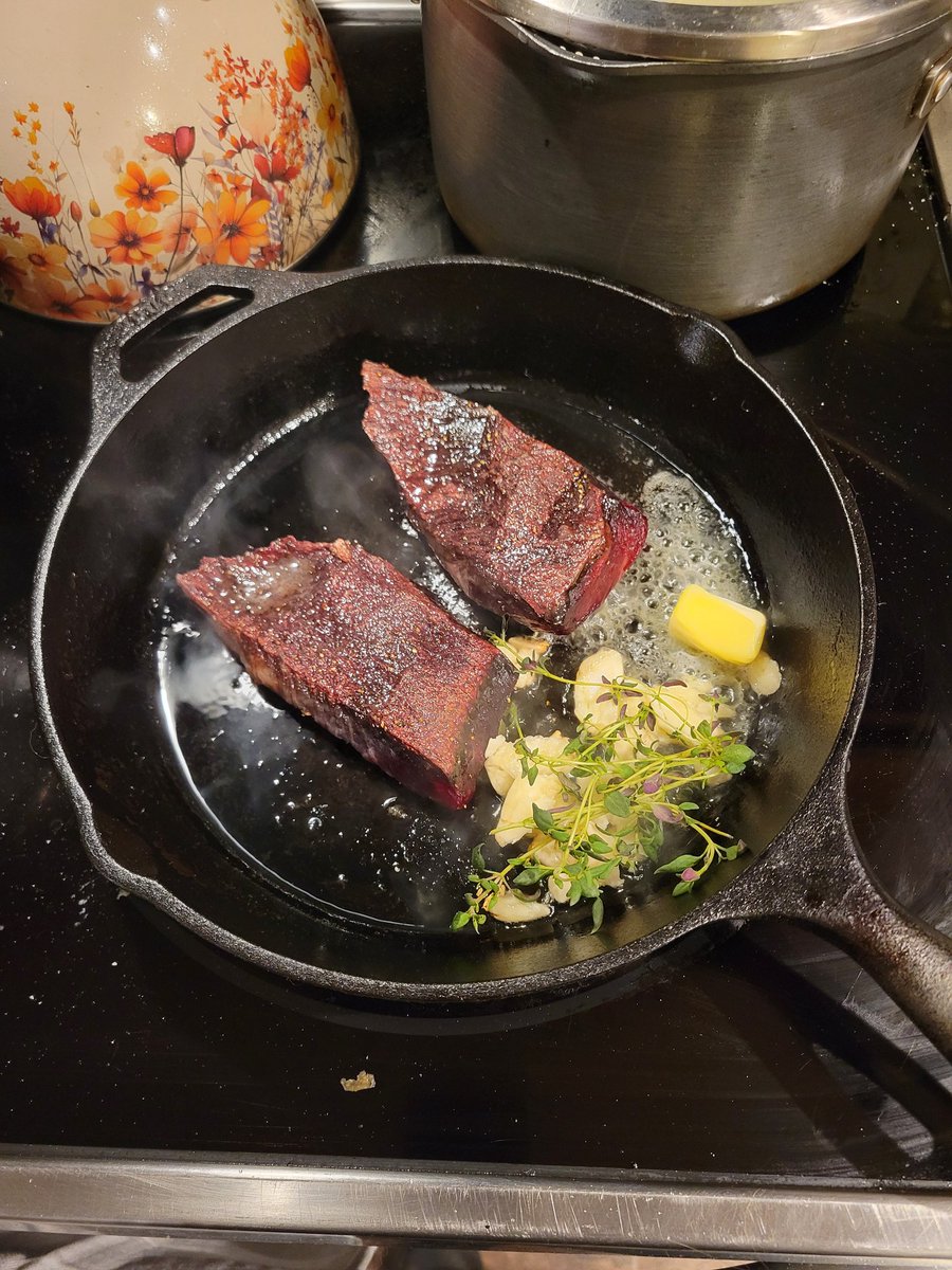 Pan-seared flank steak, argentinian red shrimp, homemade creamed corn, and steamed broccolini