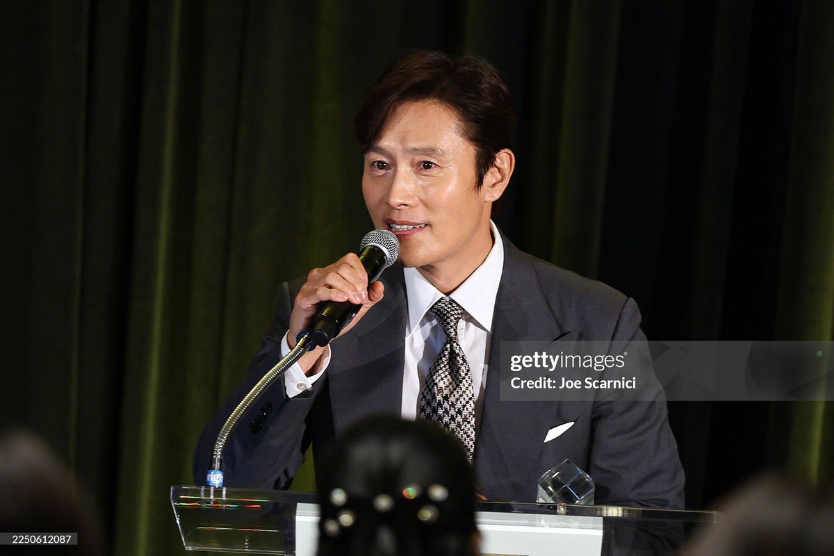 Lee Byung-hun accepts an award onstage during KALH Honors 2025