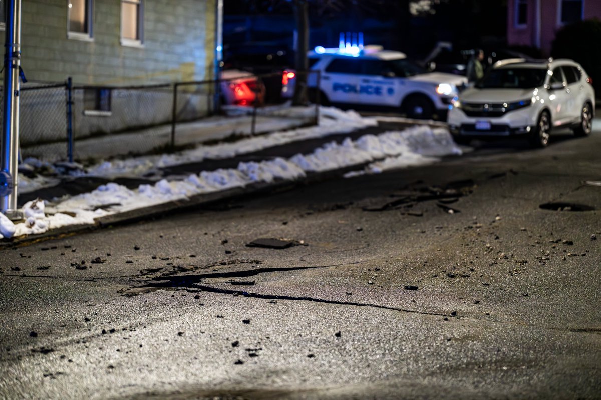 officialazari's tweet photo. Shortly after 12:30AM this morning, a water main break occurred in the area of Cohasset St prompting serious flooding that temporarily blocked Grafton St by CVS and caused a sinkhole on Cohasset St almost swallowing a vehicle (pictured). Grafton St has since been reopened. https://t.co/eIO56Dy1nO