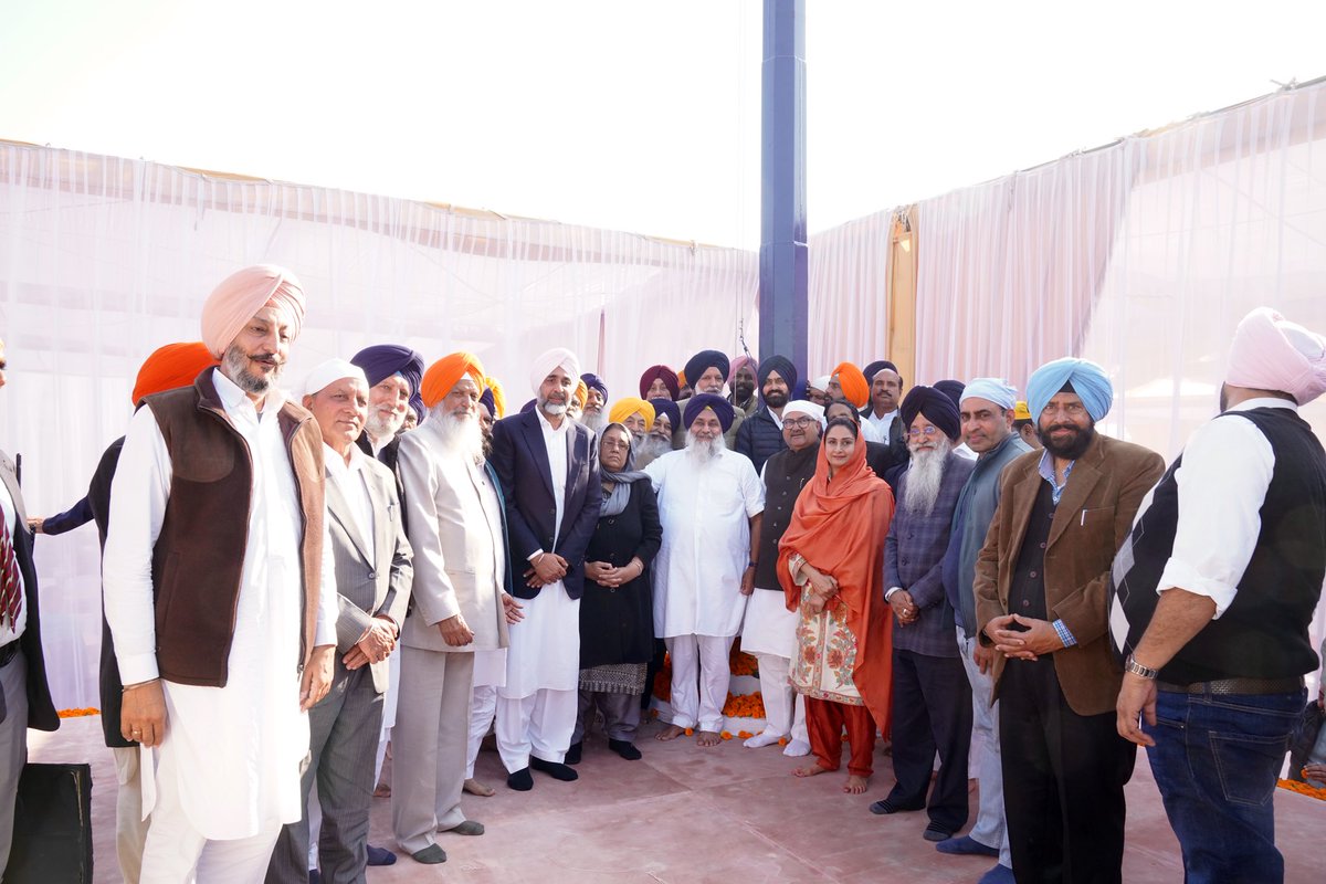 officeofssbadal's tweet photo. As we collectively unveiled the statue of five-time Chief Minister Sardar Parkash Singh Ji Badal and a 70-foot-tall Akali flag amidst thunderous slogans of “Sardar Parkash Singh Badal Amar Rahe” raised by his followers and Shiromani Akali Dal workers, I was spellbound by the deep chord Badal Sahab had struck in every heart.
A true people’s man, who carried the spirit of Punjabiyat in his heart and gave paramount importance to peace and communal harmony, Badal Sahab will forever be remembered for taking everyone along, and for doing the utmost for the Kisan and the poor.
While the installation of Badal Sahab’s statue and the party flag (on his 98th birth anniversary) is a moment of immense pride for the entire Shiromani Akali Dal family, we will build on this legacy by establishing a museum dedicated to his life and achievements at the same site in Badal village.