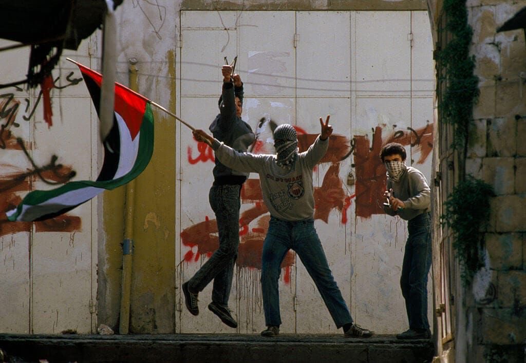 GAZA: THE BIRTHPLACE OF THE INTIFADA December 8, 1987 — 38 years ago today, the First Intifada broke out in Palestine when a zionist truck driver ran over a row of cars filled with Palestinian workers in Jabalia Camp in Gaza, murdering four young men. In response, thousands of