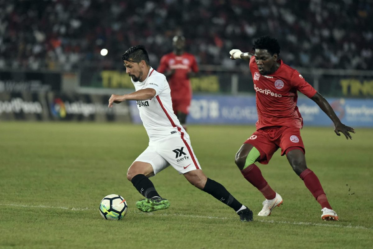 SevillaFC_ENG's tweet photo. Happy Independence Day, Tanzania! 🇹🇿

Heri ya Uhuru to all our friends — we fondly remember our 2⃣0⃣1⃣9⃣ match against Simba SC and the warm welcome in Dar es Salaam. https://t.co/p9VctTZdW7