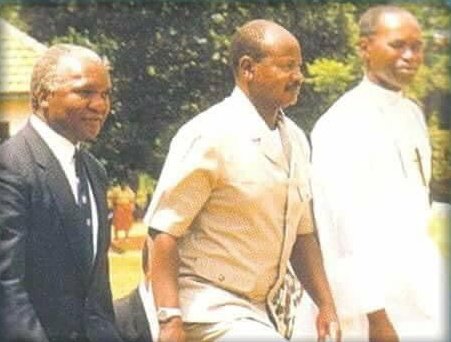 This is 1989 at St.Mary’s College Kisubi, The Head of State then, was attending a fundraising ceremony. 

On his right is SMACK OB, The Late Paul Kawanga Ssemwogerere and left is Br. Joseph Tinkasimire .