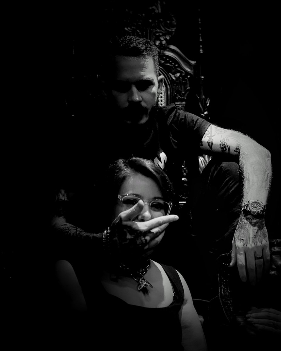 Two souls stitched together in darkness.