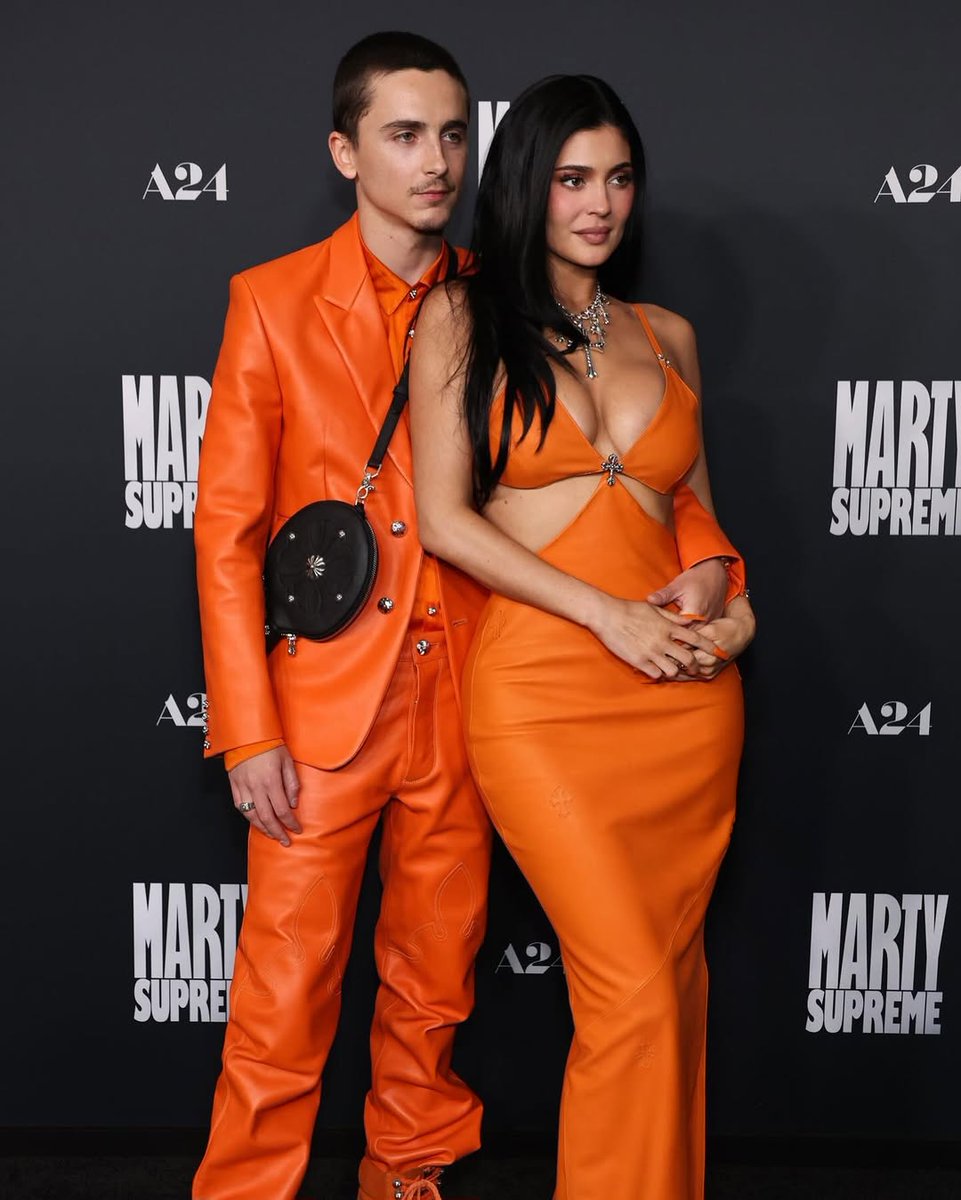 theNETng's tweet image. Timothée Chalamet and Kylie Jenner step out in matching orange outfits as they attend the ‘Marty Supreme’ premiere 🧡

#trending #kardashian
