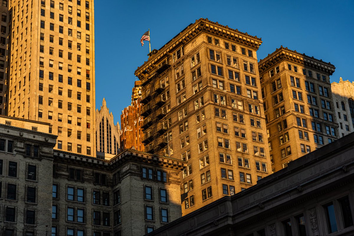 Detroit’s facades ignite in golden hour light, with warped buildings rippling through mirrored reflections.

#Detroit #GoldenHour #Cityscape #UrbanPhotography #architecturelovers