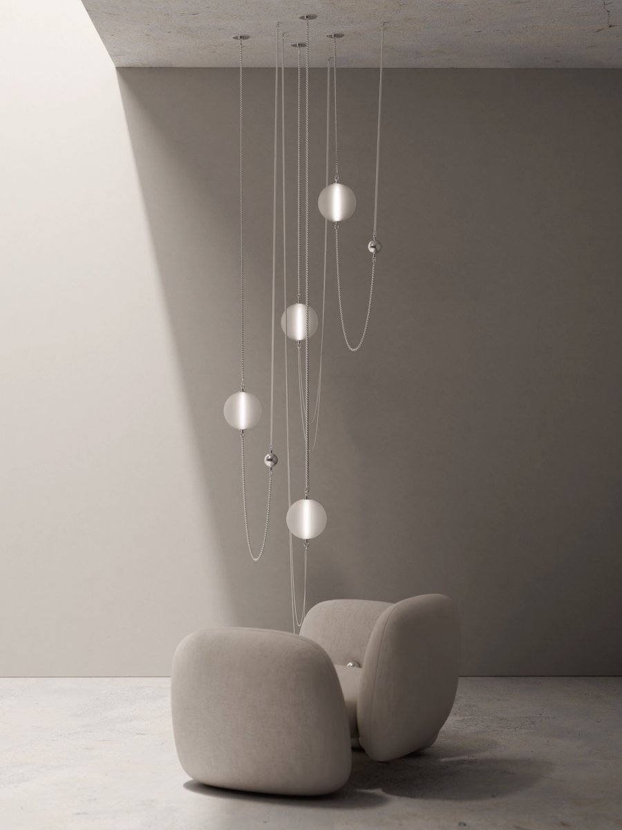 The Bacio Lounge Chair and Etere Pendant Lights bring together grounded form and aerial elegance. Chains, orbs, and diffused glow create a fluid vertical rhythm that complements Bacio’s rounded silhouette.

Designed by Xavier Delvallee.