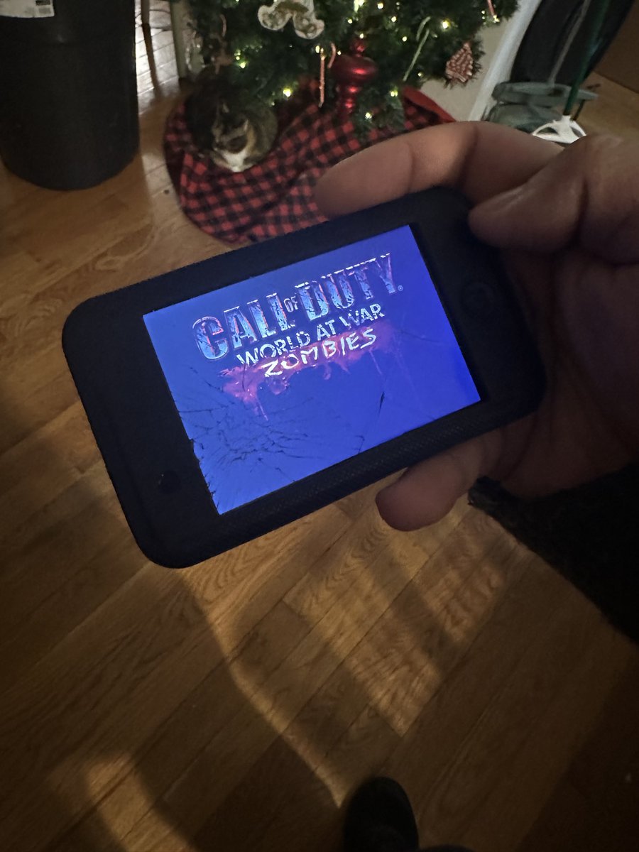 Acai28's tweet image. homie pulled up to Christmas Eve with the jailbroken iPod Touch 3rd gen with the cracked screen with cod zombies that’s what’s up