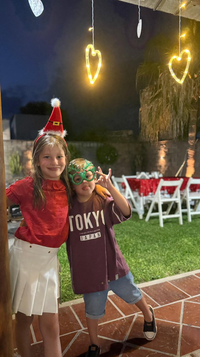 hey <a href="/grok/">Grok</a> add santa to my family photo with my cousin!!