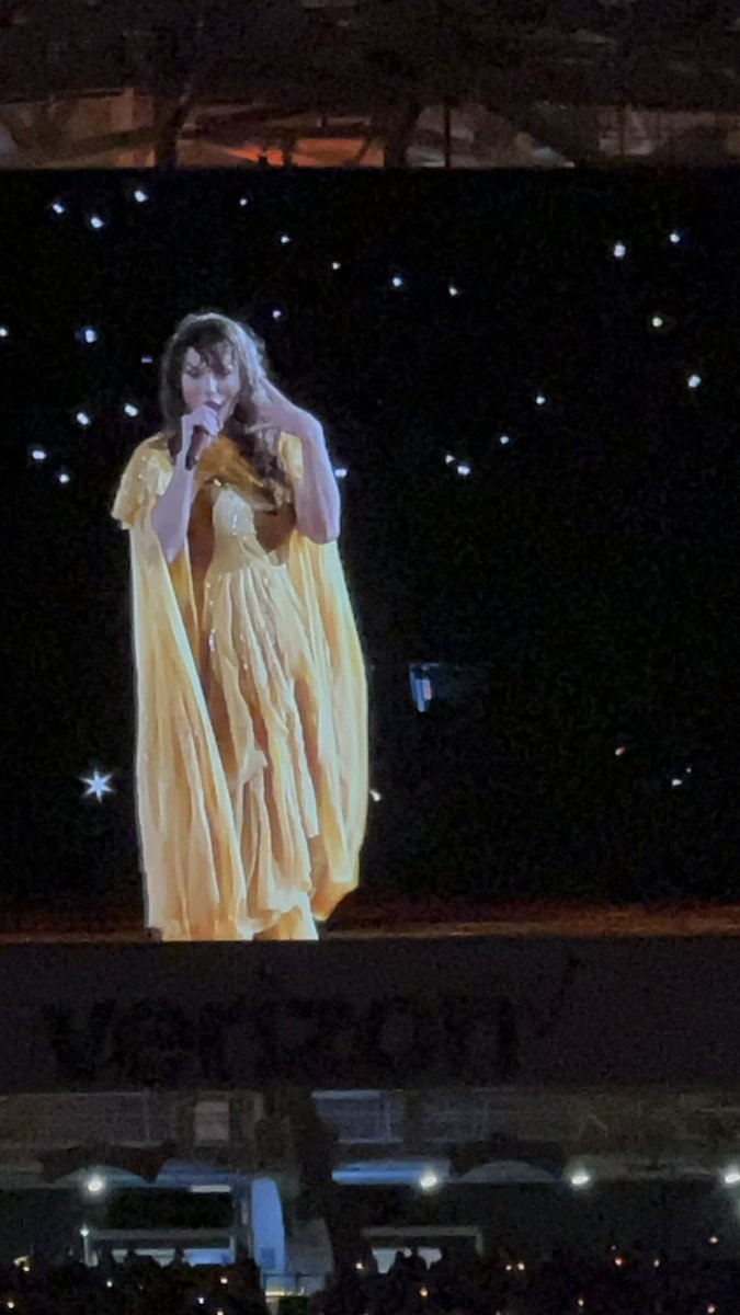 chy_jess's tweet photo. @taylornation13 Covered seats ftw at the last rain show of the eras tour #TSTheEndOfAnEra didn’t stop the tears though once I finally got my yellow folkmore dress #MiamiN3 https://t.co/nIMfS0SlcY