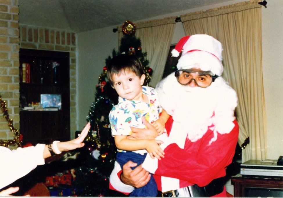 I was 9 or 10 when I found this photo.

It was after my little brother went to sleep. I was browsing old photos in my living room while my Mom did Bible study in the kitchen.

I remember thinking it was odd that Santa was wearing safety goggles while holding me.

I then wondered