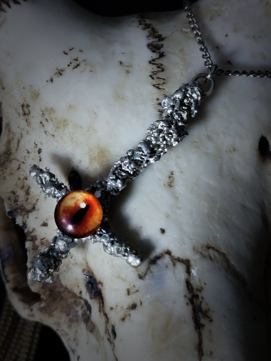 Tombthread666's tweet image. Infernal Vigil – Molten Draconis Cross

Handmade inverted cross necklace with a molten, infernal aesthetic.
Each piece is shaped by hand, giving it an intentionally rough and organic surface that evokes forged metal rather than polished jewelry.